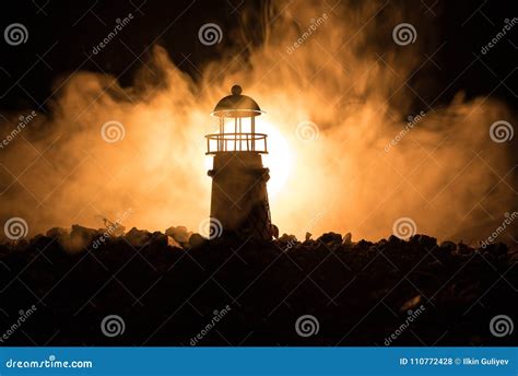 Lighthouse With Light Beam At Night With Fog Stock Photo Image Of