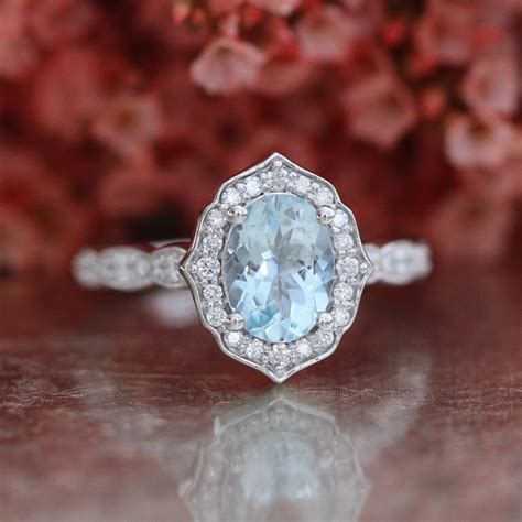 I'm planning to propose with a spare ring before letting her choose her own. Vintage Floral Oval Aquamarine Engagement Ring in 14k White