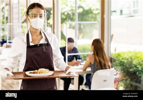 Asian Waitress Serving Food New Normal Stock Photo Alamy
