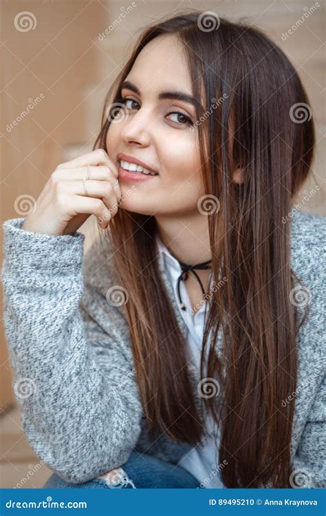 Portrait Of Smiling Caucasian Brunette Young Beautiful Girl Woman Model With Long Dark Hair And
