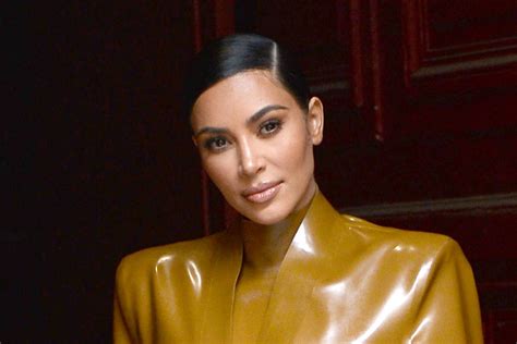 Kim Kardashian Looks Edgy In A Leather Romper And Knee High Yeezy Boots