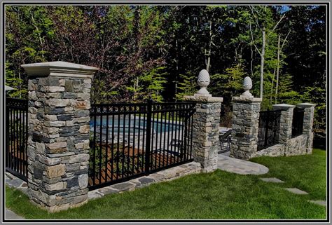 Aluminium Fence with stone columns by Artistic Outdoors | Aluminum