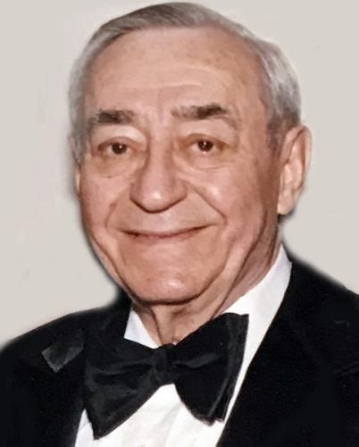 Fully massed wreath with a pure white chrysanthemum base with a small rose and carnation cluster. Salvatore Astarita - Obituary
