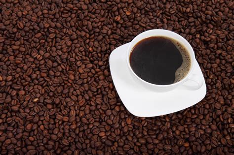 Cup Of Coffee With Beans Free Stock Photo Public Domain Pictures