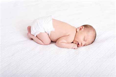 Royalty Free Photo Baby In White Disposable Diaper Sleeping On White