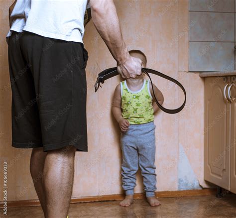 Angry Father With Belt And Scared Child Stock Photo Adobe Stock