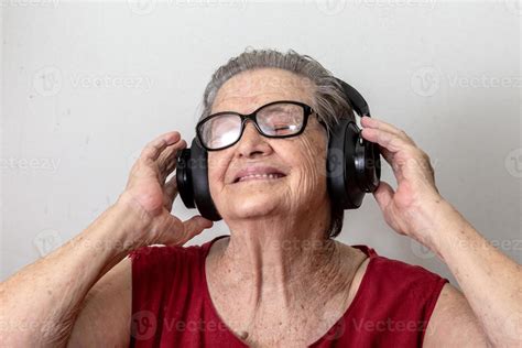 Funny Old Lady Listening Music And Dancing On White Background Elderly