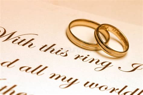 Wedding Rings And Vow Two Wedding Ring Laying On A Paper With Text Of