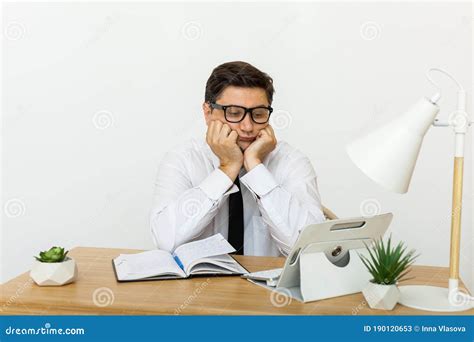 Bored At Work Concept Tired Unmotivated Male Worker Wasting Time At