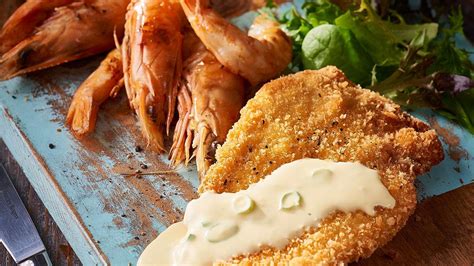 To make chicken schnitzel you make it the same way you would make a veal schnitzel or pork schnitzel. Chicken Schnitzel, Jumbo Prawns, Garlic Sauce - Recipe ...