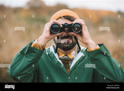 Man Looking Through Binoculars Stock Photo Alamy