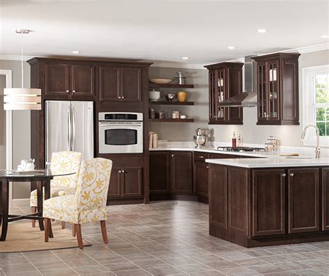 Choosing timeless dark cherry kitchen cabinets and accenting them with aged elements, like seeded glass and oil rubbed bronze hardware, are key to holding tight to the past. Dark Cherry Kitchen Cabinets - Homecrest Cabinetry