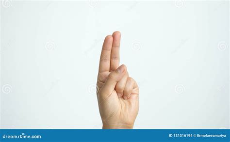 Close Up Of Isolated Female Hand Shows Two Fingers Up Isolated On White