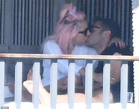 Lady Gaga Puts On Cheeky Display In Black Thong As She Snuggles Up To Her Mystery Man In Miami