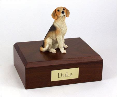 Following the cremation ashes are carefully collected and prepared before the next cremation can commence. Beagle cremation figurine urn w/wooden storage box
