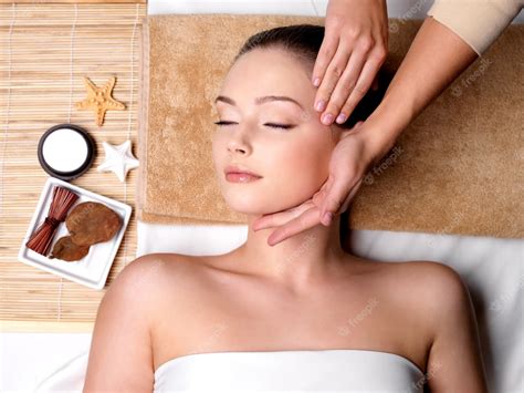 Free Photo Pampering And Massage For Beautiful Face Of Young Woman In Spa Salon