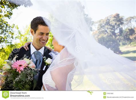Romantic Newlywed Looking At Each Other In Park Stock Photo Image Of