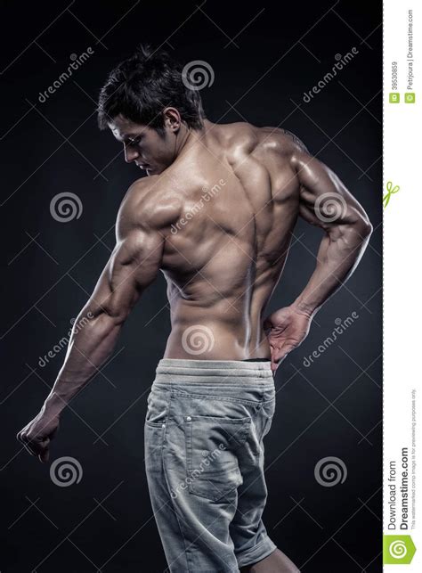 Strong Athletic Man Fitness Model Posing Back Muscles Stock Image