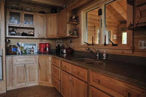 Wide view of oak kitchen cabinets, a wood floor, stainless kitchen appliances, and empty countertop. Hand Crafted Solid Oak Kitchen Cabinets: Grove
