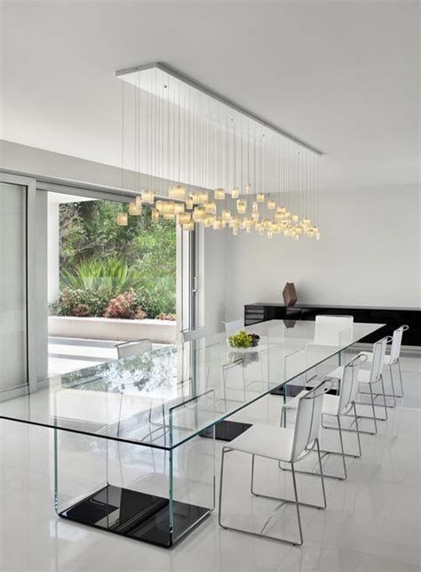 In paris' gritty 10th arrondissement, this chic dining room features a pair of 1930s french chairs that are upholstered in an african wax print fabric, a set of louis xvi dining chairs in a sanderson fabric and a ceiling fixture by michael anastassiades. 30 Ways To Incorporate A Glass Dining Table Into Your ...