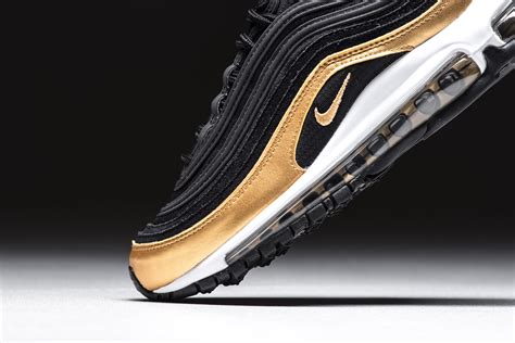 Black And Metallic Gold Cover This Nike Air Max 97
