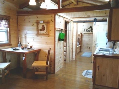 A Kitchen And Dining Area In A Cabin