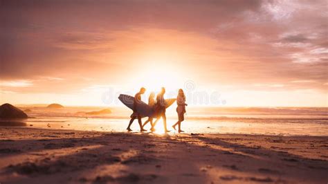 People Walking On Beach During Sunset Stock Image Image Of Dawn