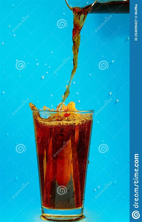 Cola Is Poured Into A Glass Splashing Around Stock Image Image Of