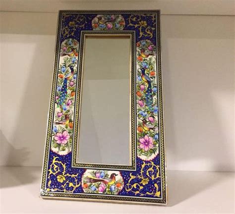 Beveled edges, a circular shape and a mirrored crystalline frame make this modern mirror gleam. Khtam inlaid , hand painted Persian miniature mirror with ...