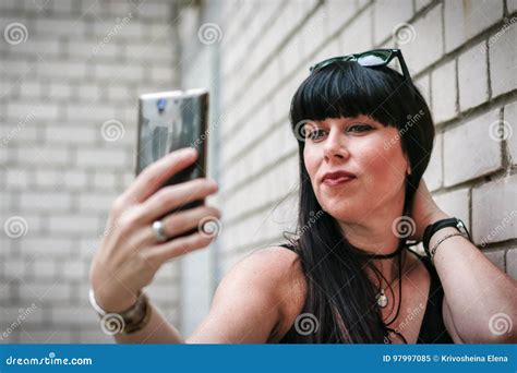Woman Taking A Selfie Near A Wall Stock Image Image Of Casual Camera 97997085