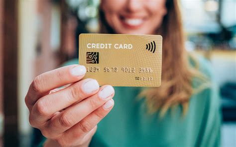 This is a good source of getting emi for the people who do not possess a credit or a debit card. Woman Holding A Credit Card Stock Photo - Download Image ...