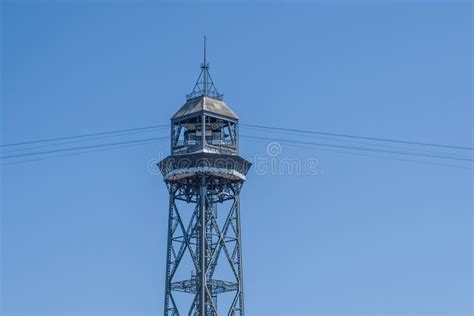 Tower Of The Cable Car In Barcelona Next To The Seaport And Beach
