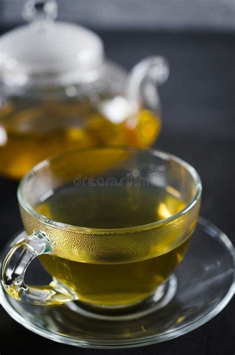 Cup Of Delicious Herbal Tea And Glass Teapot Stock Image Image Of