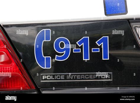 911 police emergency telephone number printed on the rear of a police