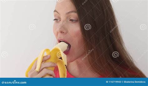 Woman Peeling A Banana And Eating White Background Stock Video Video