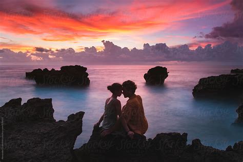 Couple On The Beach At Sunset By Stocksy Contributor Alexander Grabchilev Stocksy