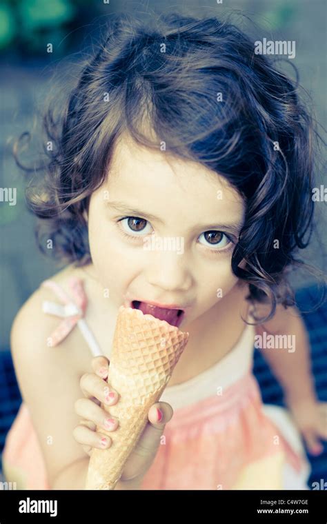 Girl Eating Ice Cream Cone Photo Stock Alamy