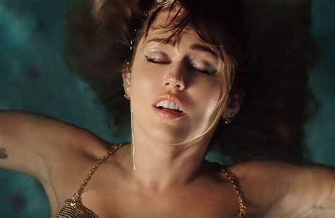 Watch Miley Cyrus Goes Underwater For Break Up Anthem Slide Aways