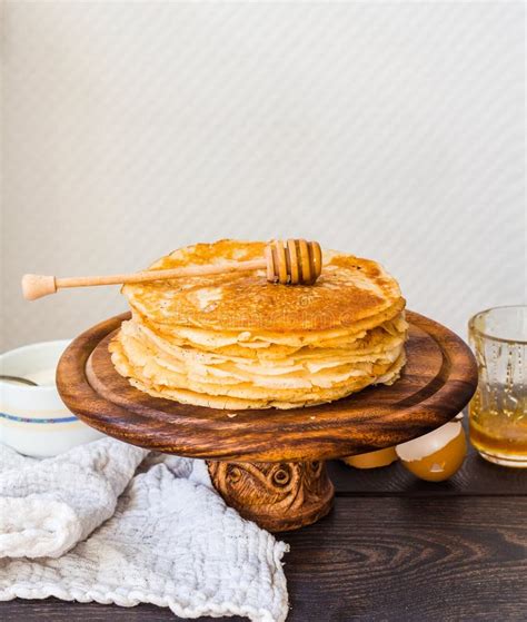 Thin Sweet Pancakes With Honey On A Wooden Stand Breakfast Stock Photo