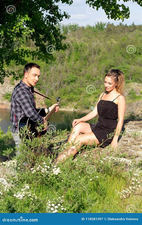 Young Attractive Man Playing Guitar For His Beautiful Girlfriend Stock Image Image Of Girl