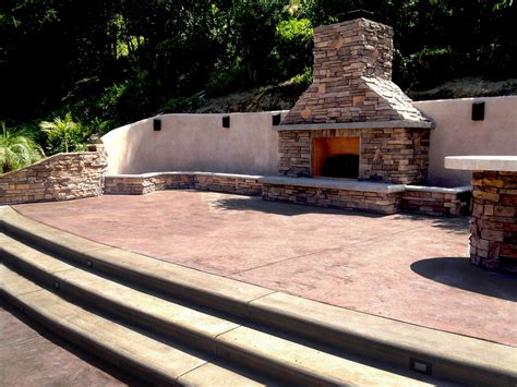Our outdoor fireplaces often become the central focal point of an exterior landscape. Outdoor fireplace; retaining wall, stamped concrete ...