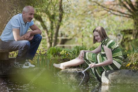 Old Man And Young Girl At Pond Stock Image F0037453 Science