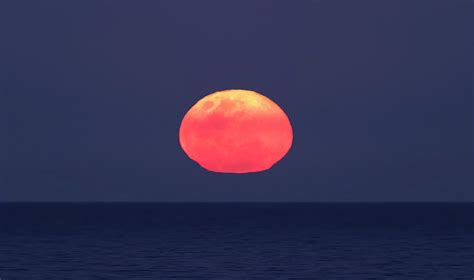 Moon Rising Over The Sea Photograph By Luis Argerich Fine Art America