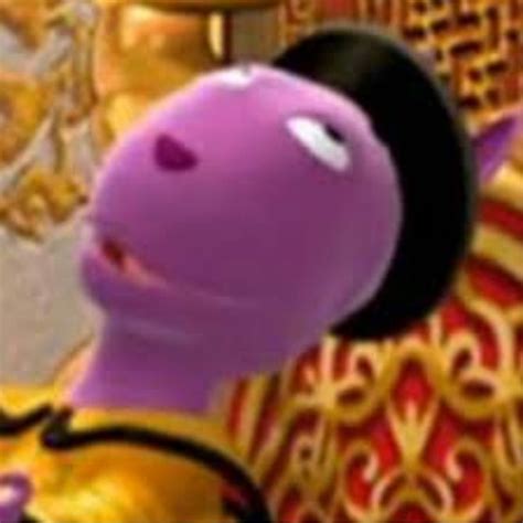 A Close Up Of A Purple And Gold Character