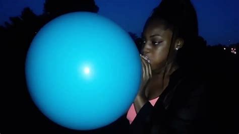 girl blowing up 36 inch teal qualatex balloon youtube