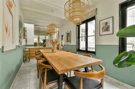 A Long Dining Room With A Wooden Table And Chairs Editorial Photo