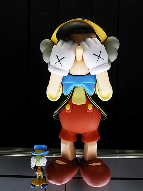 Releases Kaws “pinocchio And Jiminy Cricket” Figures Arrested Motion