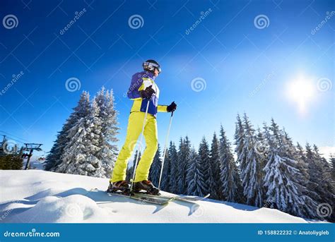 Happy Woman Posing On Skis Before Skiing Sunny Day At Ski Resort Clear Blue Sky Snow Covered