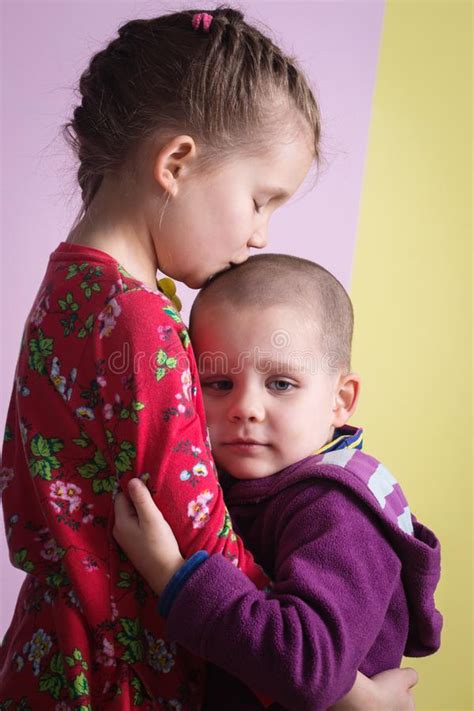 Little Girl Hugging Crying Boy Photos Free And Royalty