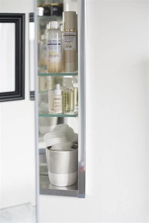 Because the cabinet is built into the wall, no one will ever know there's a medicine cabinet there, unless they move the picture frame. Roundup : Medicine Cabinets - Room for Tuesday